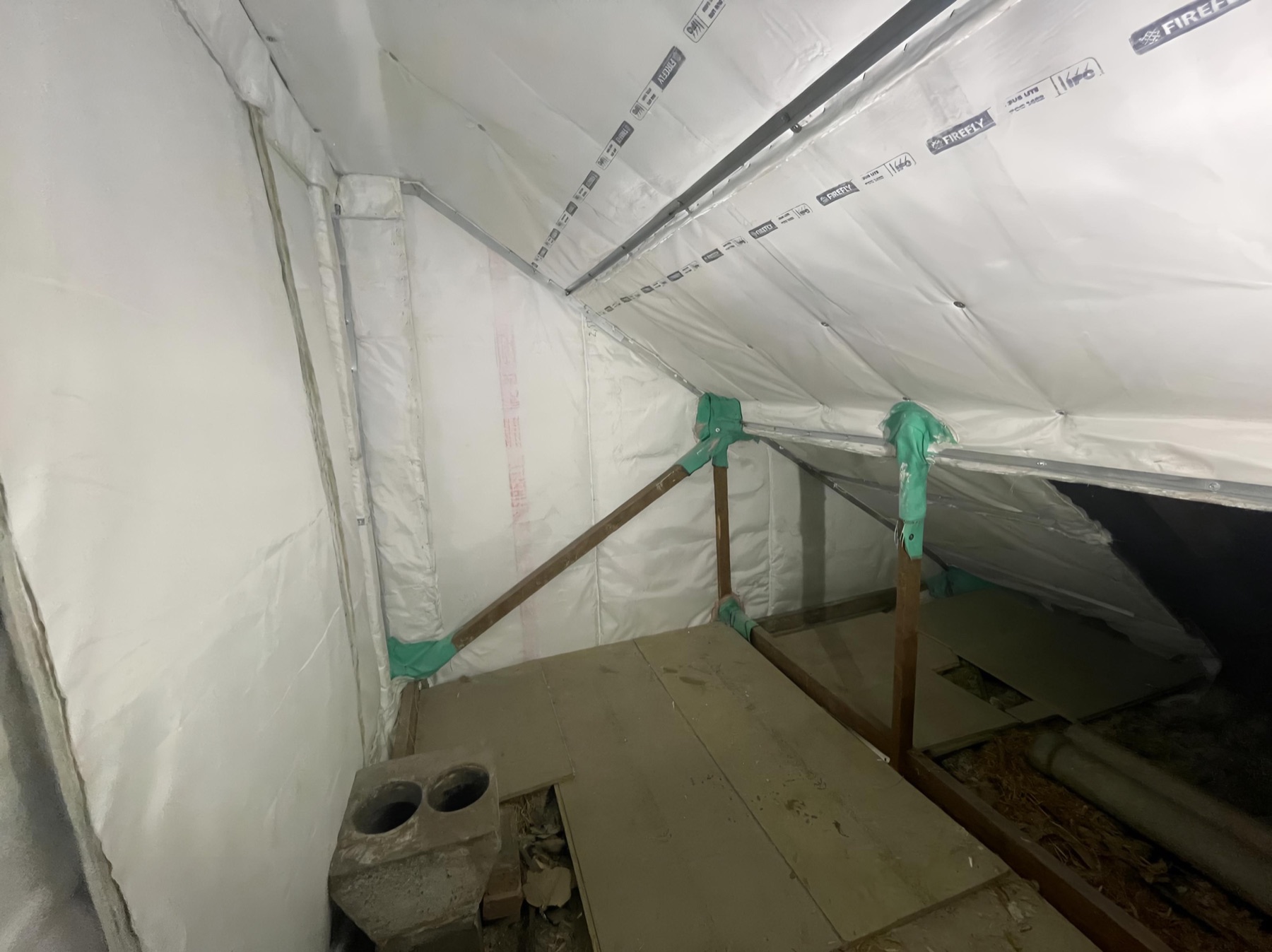 Firefly passive fire barrier installed through a roof void