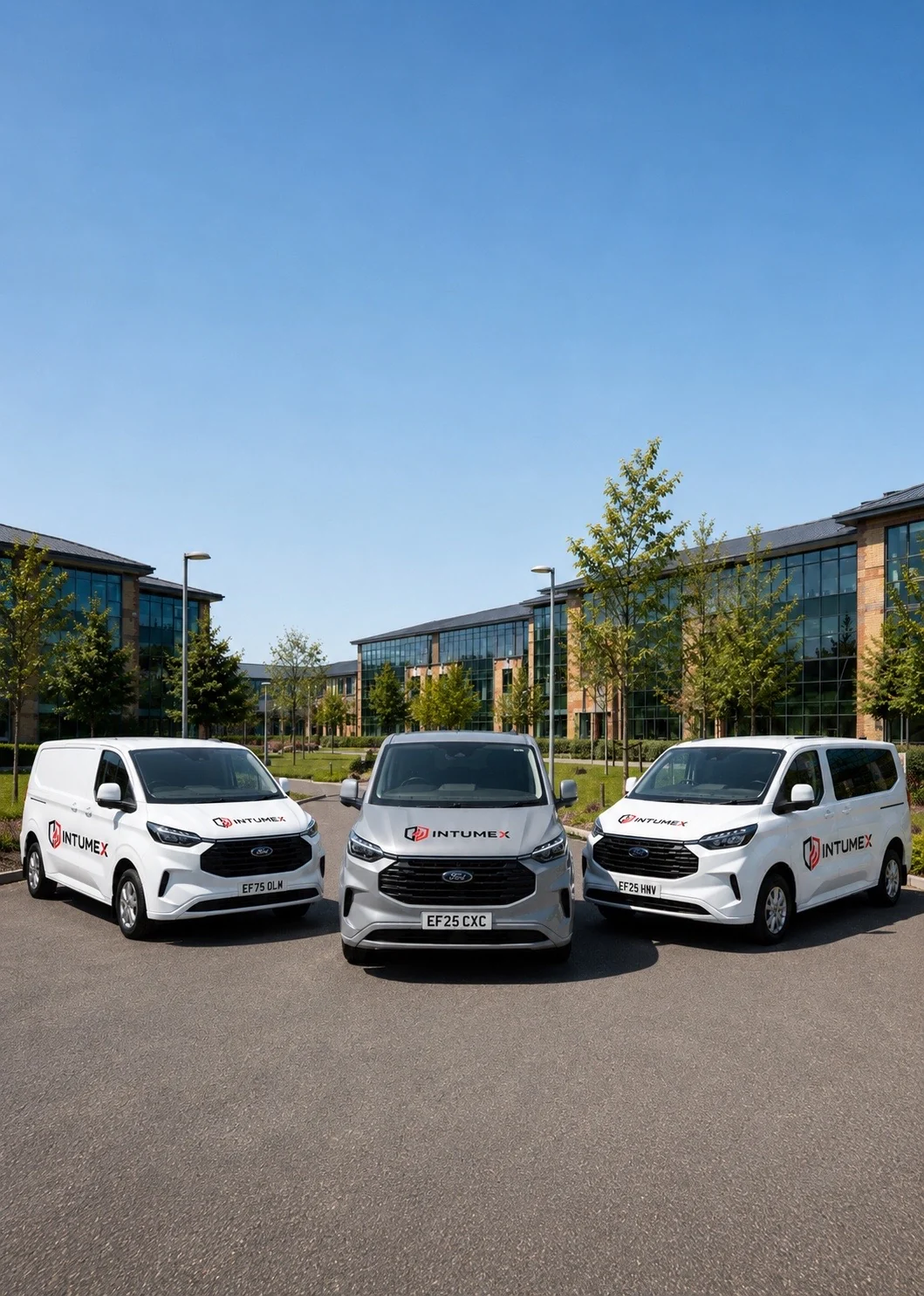 INTUMEX branded vans outside commercial building