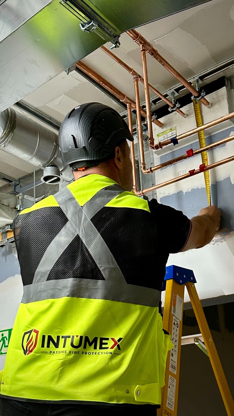 INTUMEX operative carrying out passive fire protection measurements
